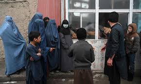 Afghan women waiting outside an office in the country